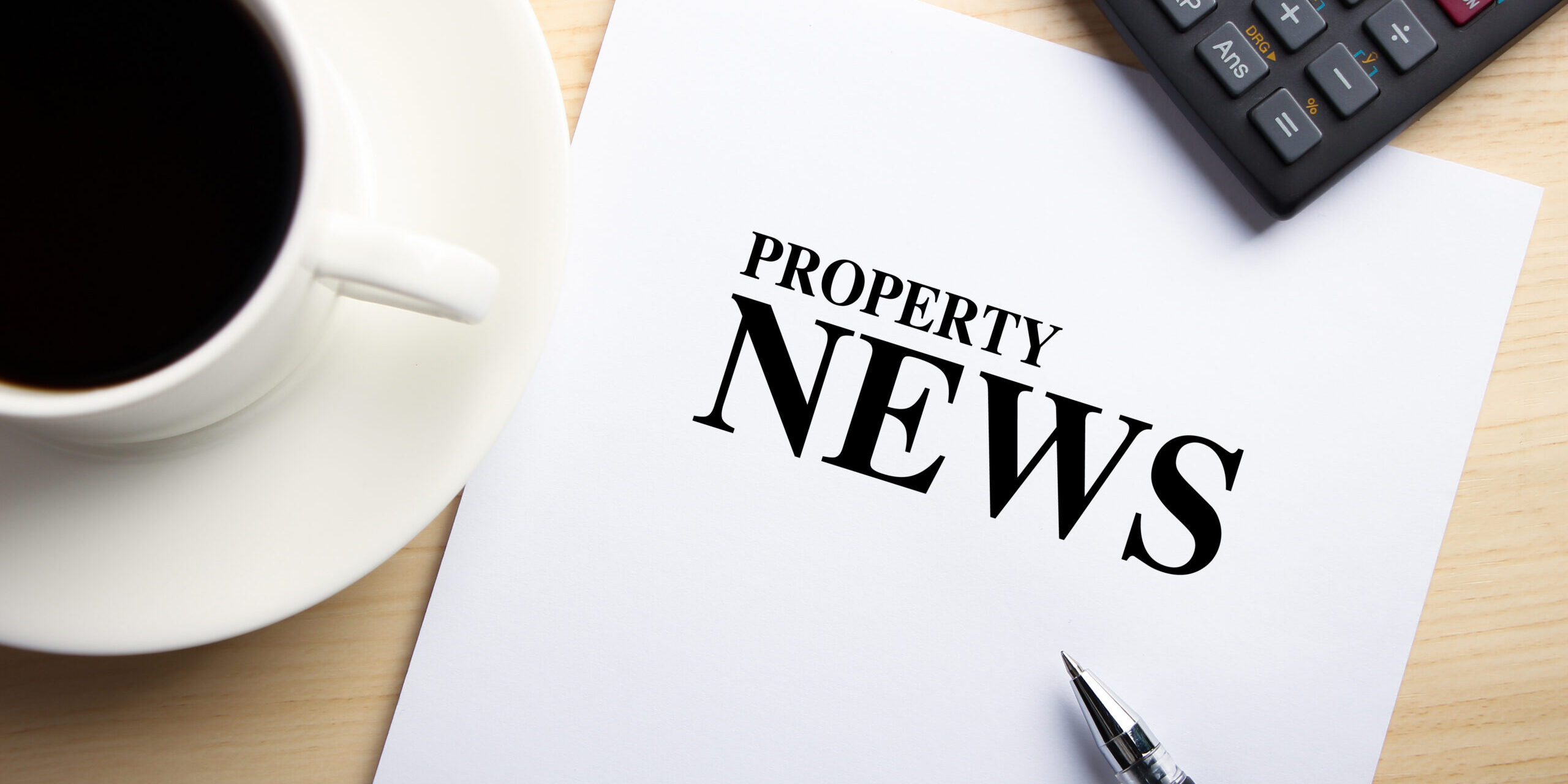 Text,Property,News,Is,On,The,White,Paper,With,Coffee,